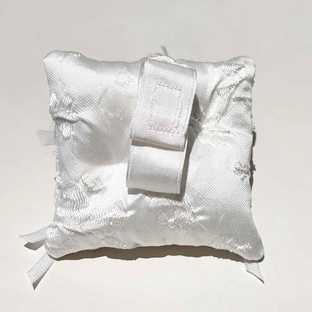 The back of this Dog Ring Bearer Cushion is just as exquisite as the front, featuring a soft, durable fabric designed for both comfort and style. Carefully crafted with attention to detail, it ensures that your furry friend will carry the cushion with ease, while adding an extra touch of elegance to the overall design. Perfectly tailored for your pet's role as a ring bearer, it’s a beautiful blend of functionality and sophistication.