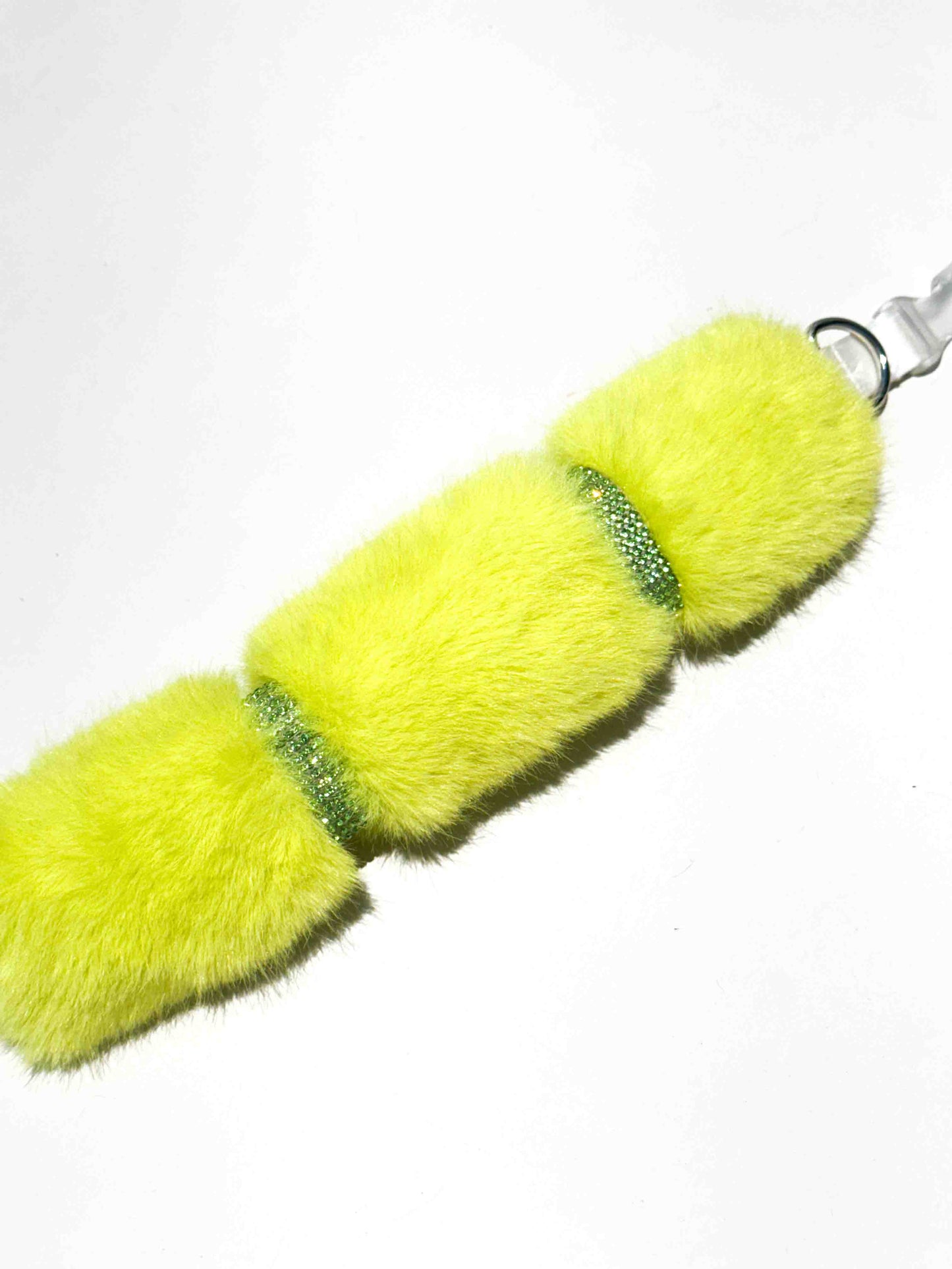 A luxurious dog collar in vibrant yellow fur with sparkling rhinestone accents, showcasing a colorful and elegant accessory for pets.