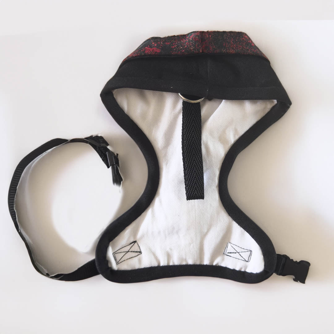 The red damask tuxedo style harness not only offers style and elegance to your dog, but also provides a practical solution for control during outdoor activities.