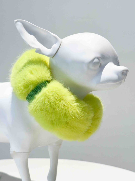 A luxurious yellow fur dog collar adorned with sparkling rhinestones, displayed on a white dog mannequin, showcasing a stylish and elegant accessory for pets.