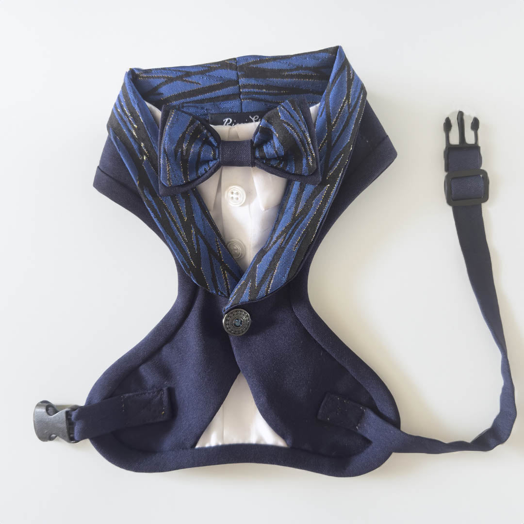 The blue jacquard tuxedo style dog harness is an elegant and sophisticated garment designed for our four-legged friends. Made with blue damask fabric